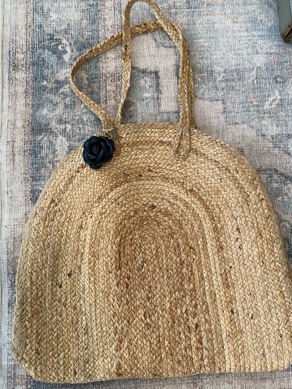 A Classy Chic Boutique Natural Straw Shoulder Bag with Black Flower Charm